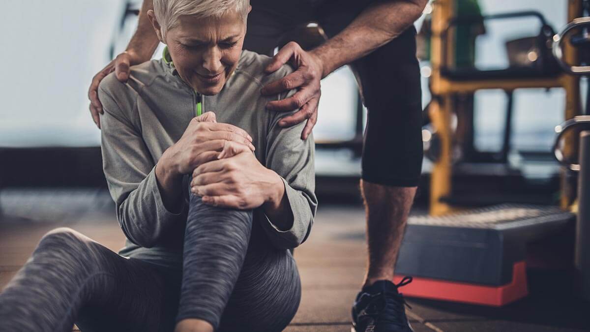 woman reeling in knee pain